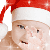 Santa Baby waving hello emoticon (Christmas Emoticons)